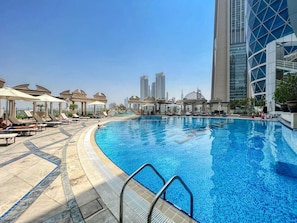 Rooftop Oasis: Dive into luxury at our stunning pool with city skyline views!