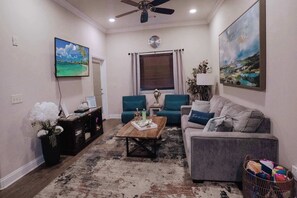Another angle of the lovely living room. Tv with all your favorite apps and a sofa bed.