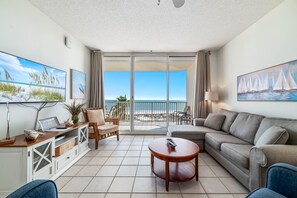 The combination of natural materials, subtle coastal accents, and abundant natural light creates a warm and welcoming ambiance.