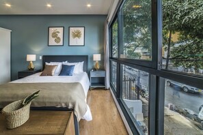 The big windows come with curtains + blackouts.