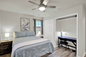 The second bedroom features a built-in work area.