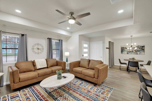 Get comfy in the large, bright living room with its premium leather sofa and loveseat.