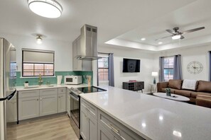 Cook in the fully equipped kitchen with stainless appliances.