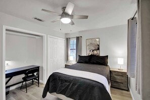 The second bedroom features a built-in work area.