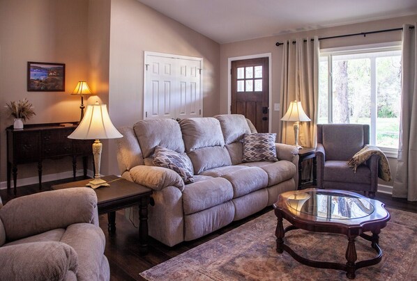 Comfortable living room with electric fireplace and smart tv. 