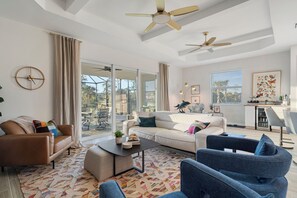 Open Floorplan sliding doors to pool and hot tub in enclosed lanai