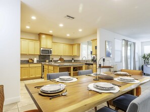 Wood slab table with 6 chairs