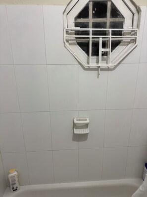 Bathroom with full length bath tub