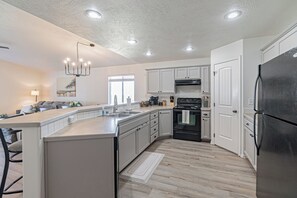 Open Kitchen-Electric Range, Large Pantry