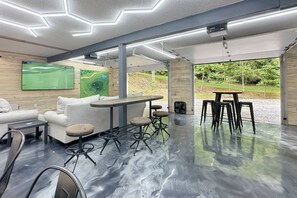 Welcome to Wolf Den - the ultimate hangout with 82" TV - play a golf match with the pros
