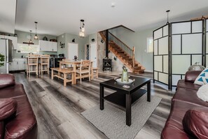 Enjoy the full cottage experience with connected kitchen, dining, and lounging areas—ideal for families or groups staying in Bruce Peninsula.