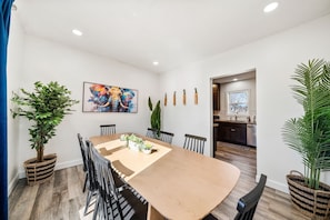 Gather around and enjoy a meal at our spacious dining table, which comfortably seats up to 8 guests. Whether it’s a family dinner, a game night, or a place to plan your day’s adventures, this inviting space is perfect for bringing everyone together.