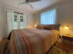 Bedroom 2 with French doors out to the deck