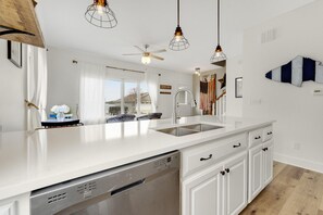 The fully equipped kitchen includes all the essentials for cooking, dining, and enjoying your stay with ease.