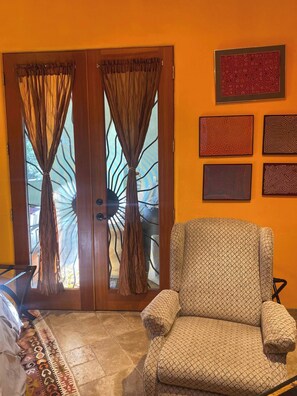 French door from front porch.  Step out to a table and chairs with your coffee.  The sun rises directly onto the east-facing porch.   