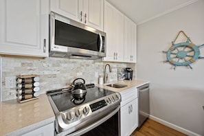 Fully equipped kitchen is ready for you to cook and enjoy your favorite meals.
