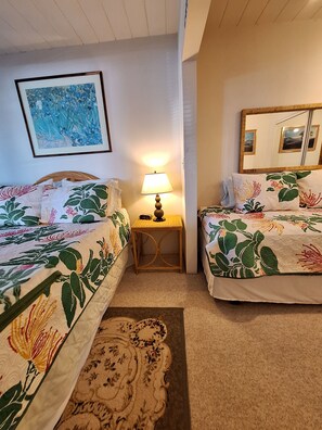 Bedroom with queen and twin beds.