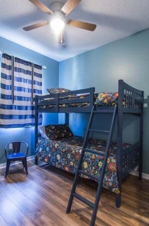 The kids will love their own space featuring a cozy bunk bed setup — ideal for winding down after a fun-filled day.