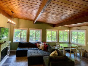 Upper Great room with uber-comfy sofa, dining area, river views from every window.