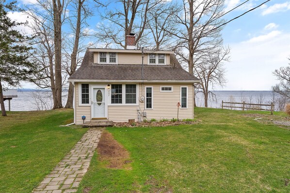Enjoy a peaceful getaway with stunning lake views and a well-maintained front yard.