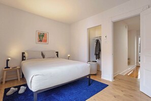 Relax in this stylish and serene bedroom, perfect for a restful night's sleep. Featuring a plush queen-size bed, soft lighting, and a cozy ambiance. Enjoy modern amenities, a spacious open closet, and a peaceful retreat in the heart of the city!