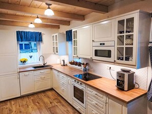 Kitchen, Countertop, Cabinetry, Furniture, Kitchen Appliance, Flooring, Wood, Major Appliance, Interior Design, Cupboard