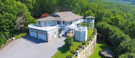 Wake up above the trees at this private Smoky Mountain retreat with epic views, 3 gazebos, and plenty of space to gather. This is where unforgettable memories are made.
