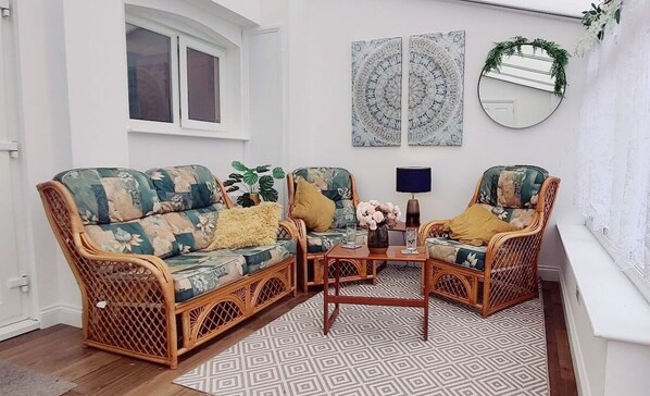 South facing conservatory with comfy seating.
