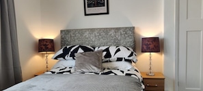 Beautiful double bedroom with dressing table and wardrobe.