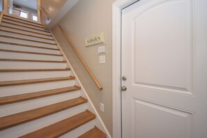 Interior stairs leading to the studio apartment