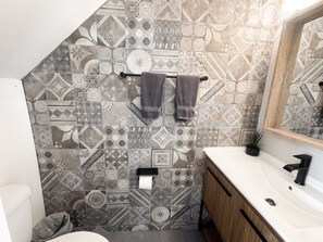 Half bathroom just outside the living on the 1st floor.