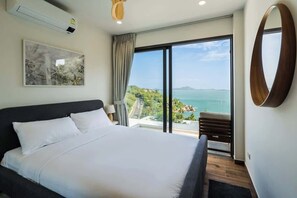 The master bedroom has a king size bed, 2 large windows with sliding doors and black-out curtains. You have access to a large balcony shared with Bedroom 2. All doors can be locked from the inside You will find AC and ceiling fans in every rooms. 