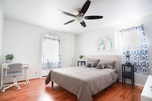 One of the bedrooms with a desk.