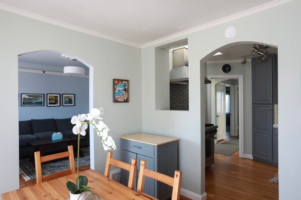 Dining area next to kitchen and living room
