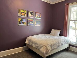 Our double, double room sleeps 4 with semi-privacy and beautiful art.