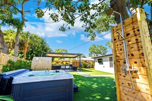 Fully equipped outdoor kitchen and BBQ grill for alfresco dining.

