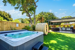 Relax in the bubbling hot tub surrounded by nature.


