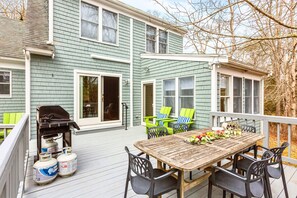 Relax on our spacious deck with cozy seating, a dining table, and a grill for perfect outdoor meals!