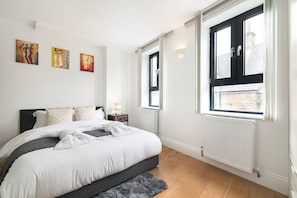 Bedroom with wardrobe, study desk and Queen size bed