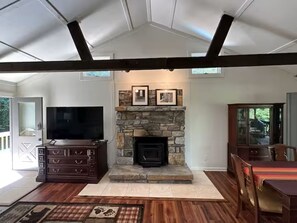 Cabin was completly renovated in 2023. But the beautiful stone fireplace remains