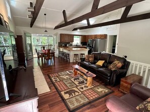 As you enter the cabin, with the stairs to the right, kitchen on the far corner