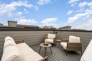 2nd Unit - Upper Deck: Private rooftop patio with outdoor seating, hot tub, and Nashville views!