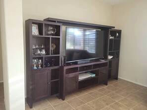 Entertainment center in great room with 70" smart TV and sound system