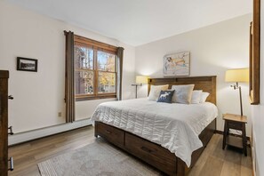 Bedroom 2: King bed, walk-in closet, natural light, blackout curtains