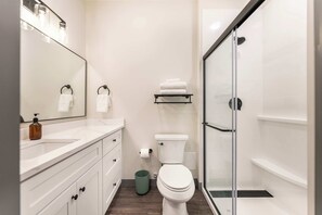 Refresh and unwind in your private bathroom, featuring a spacious shower, spotless surroundings, and plush, high-quality towels