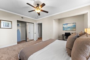 Spacious bedroom with a dedicated work area—ideal for working remotely or unwinding with a good book.