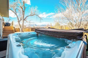Relax in the private hot tub while taking in breathtaking mountain views—perfect for unwinding after a day of adventure.