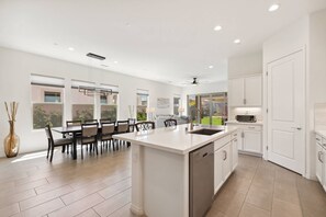 Kitchen opens to dining and living areas