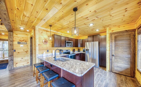 Fully stocked kitchen along with washing machine and dryer