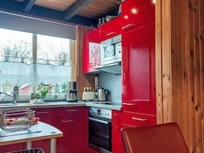 Kitchen, Red, Kitchen Appliance, Countertop, Wood, Interior Design, Furniture, Major Appliance, Cabinetry, Flooring